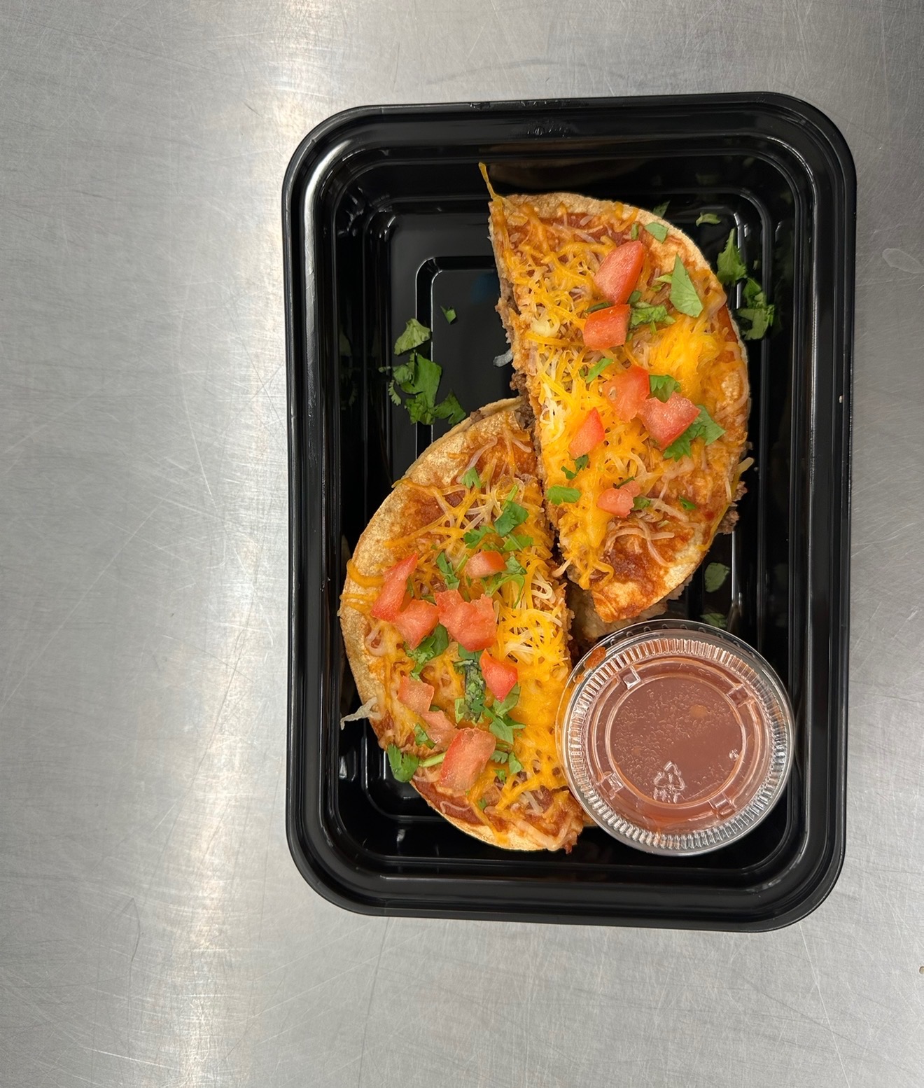 Cheese and beef birria quesadillas with consomé for dipping