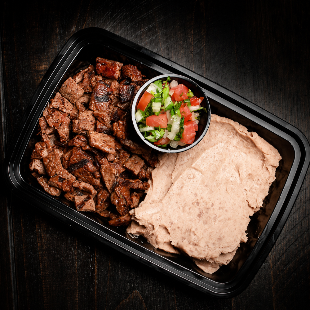 Carne asada plate with refried beans and fresh pico de gallo