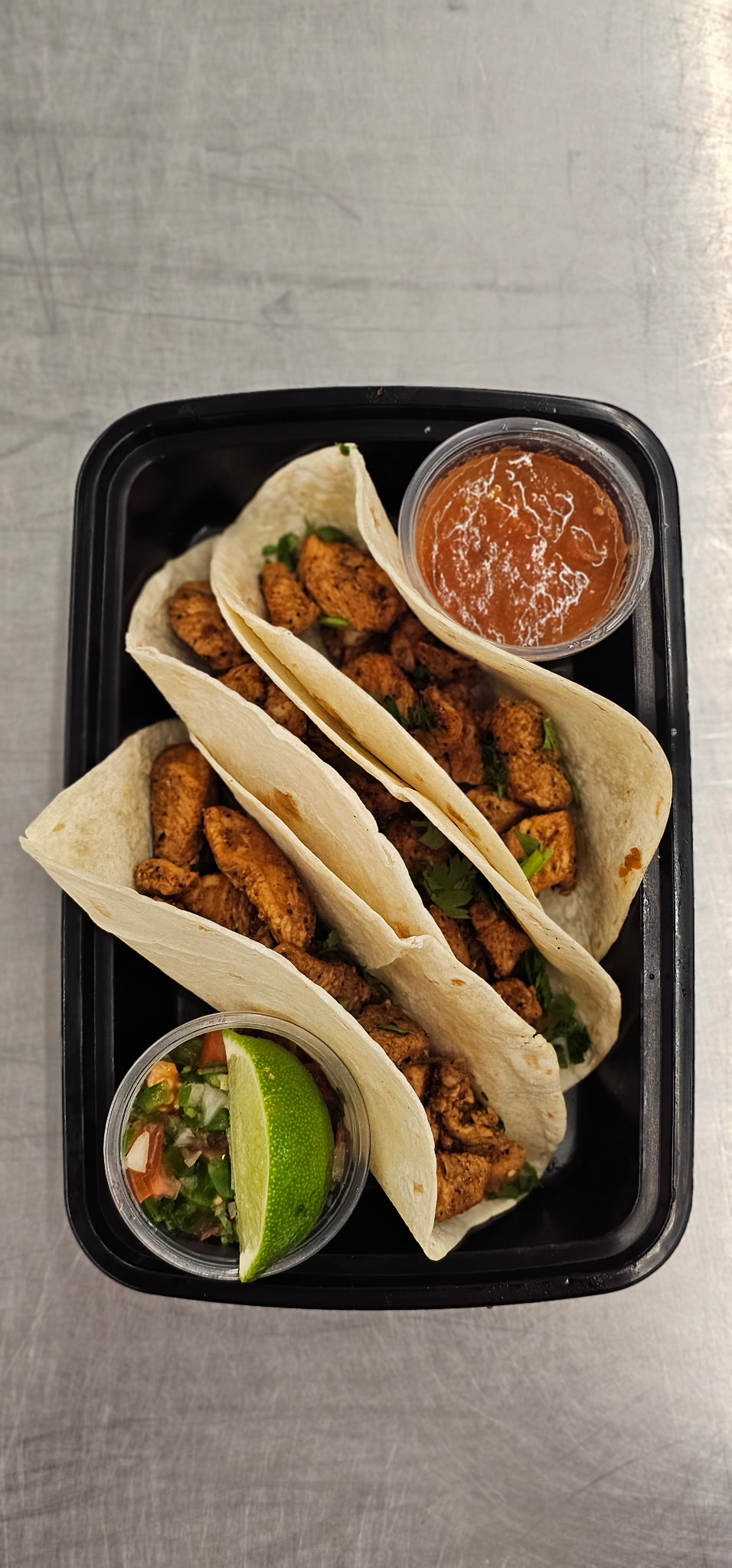 Chicken Asada Street Tacos with cilantro, salsa roja, and pico de gallo