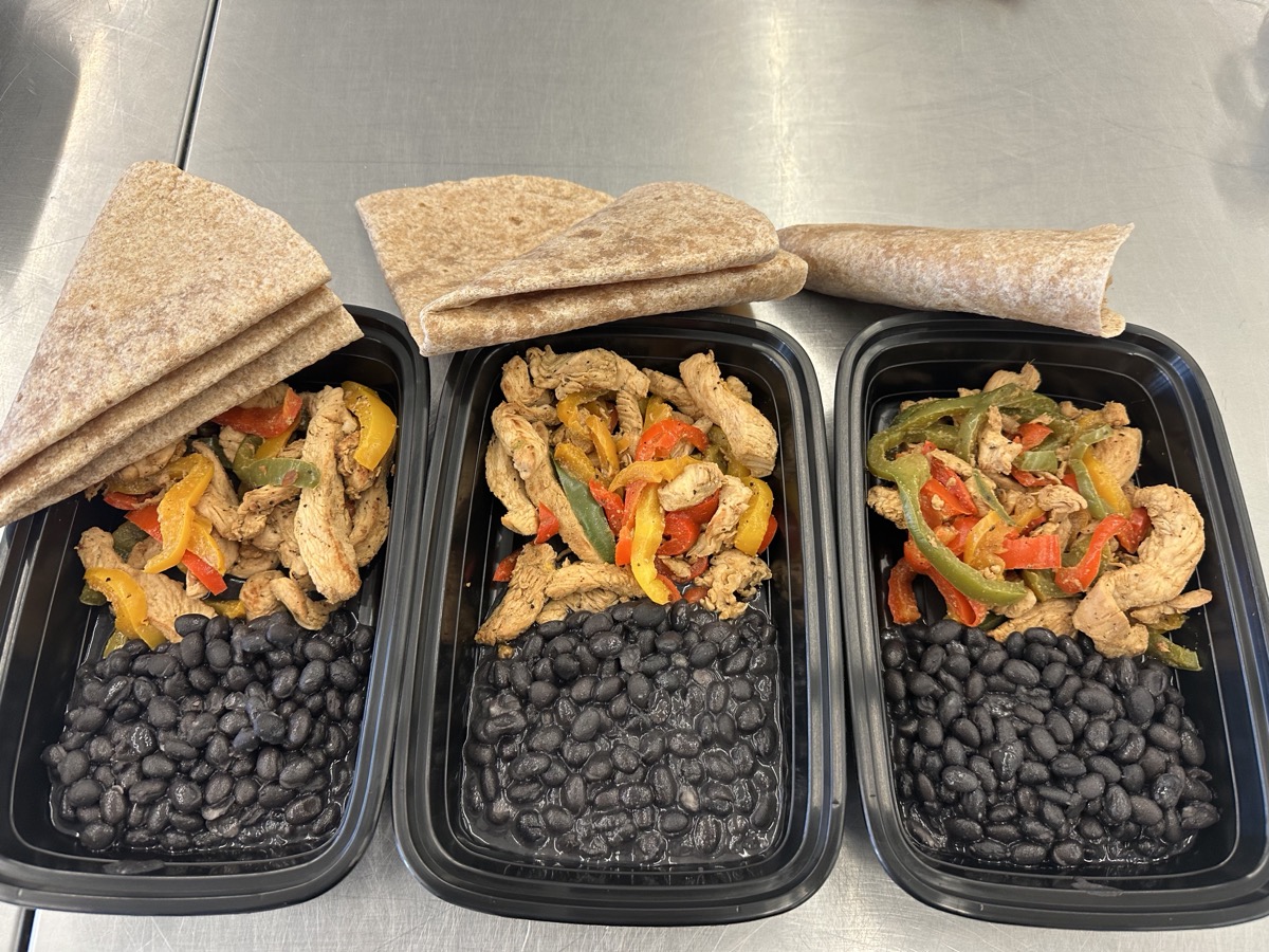 Chicken Fajitas meal prep containers with black beans and whole-wheat tortillas